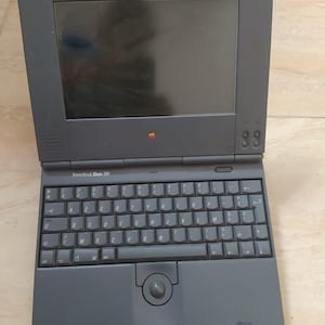 Vintage Apple PowerBook Duo 280 – Non-Functional Unit with Mini Dock and Floppy Disk Support