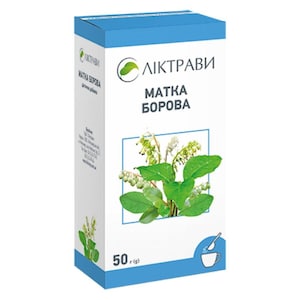 Op de afbeelding: Een wit en blauw doosje met de tekst "ЛІКТРАВИ" en "МАТКА БОРОВА". De doos bevat een illustratie van groene bladeren en witte bloemen. De onderkant van de doos geeft een gewicht van 50g aan.