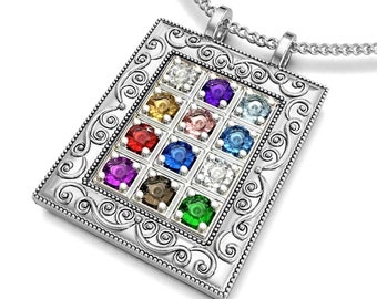 May include: Silver pendant necklace with a rectangular pendant featuring a grid of twelve colorful gemstones. The pendant has an ornate, scrolled border and is suspended from a delicate chain.