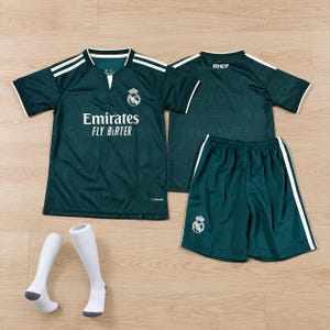 May include: A dark green soccer kit featuring a short-sleeved jersey with white stripes on the shoulders, the text Emirates FLY BETTER, and a team crest. The set includes matching shorts with a team crest and white side stripes, plus white socks.