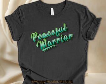 May include: Dark gray t-shirt with a green and white gradient design that says "Peaceful Warrior".