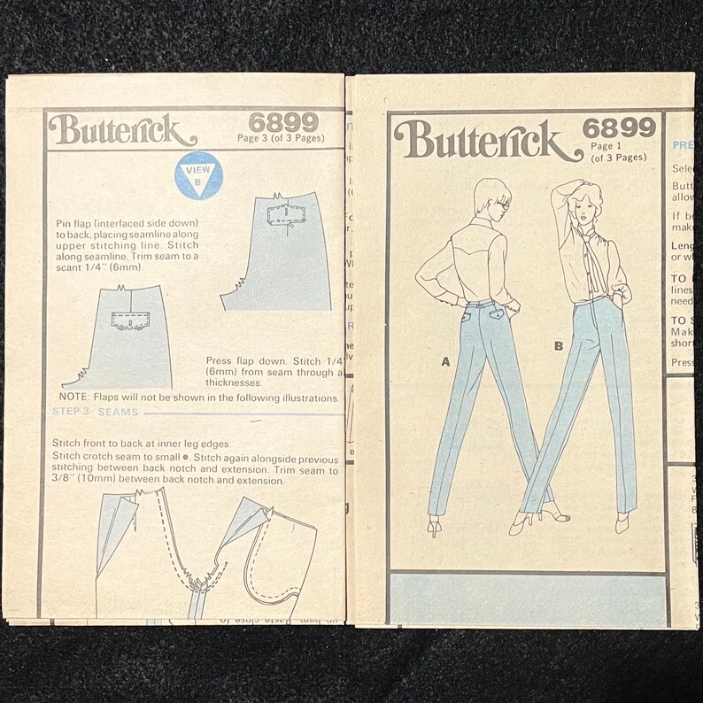 May include: A sewing pattern for trousers with instructions on how to sew the seams. The pattern includes two figures wearing the trousers, one in blue and one in light blue. The pattern is for size 6899.