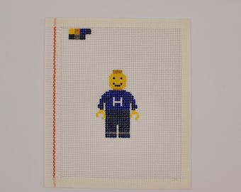 Hand-Painted LEGO Man Needlepoint Canvas – 13 Mesh – Custom Shirt Color & Letter – Ornament, Bag Tag, or Framed