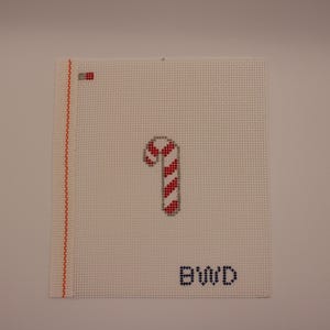 Malowane ręcznie płótno z motywem laski cukrowej: projekt ozdoby świątecznej