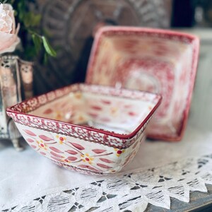 May include: A set of three ceramic mugs with a speckled, matte finish. The mugs are in shades of cream, light gray, and dark gray. Each mug has a simple, minimalist design, perfect for coffee or tea.