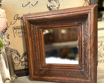 Vintage carved wood framed mirror