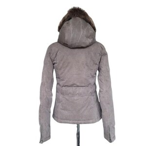 May include: A gray winter jacket with a hood and fur trim. The jacket has a zipper closure on the sleeves and a cinched waist. The hood is lined with brown fur.