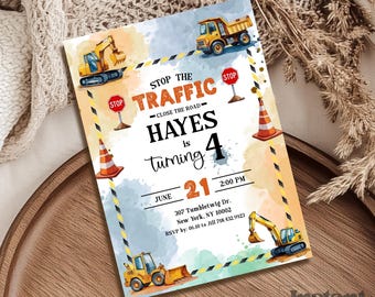 May include: A birthday party invitation with a construction theme. The invitation features illustrations of construction vehicles, traffic cones, and stop signs. The text reads "Stop the Traffic, Hayes is turning 4, June 21, 2:00 PM."
