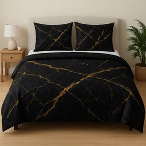May include: Black and gold duvet cover with a marble pattern. The duvet cover has a black background with gold veins running through it.