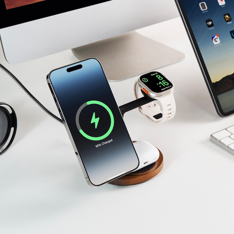 May include: A charging station with a smartphone, smartwatch, and wireless earbuds. The smartphone displays a charging icon, indicating 95% charged. The smartwatch shows the time. The station has a wooden base.