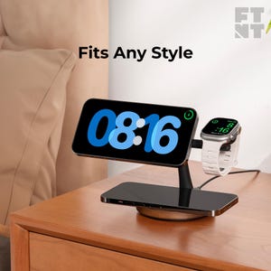 May include: Black charging station with a phone displaying the time 08:16 in blue, and a white smartwatch. The text "Fits Any Style" is above the phone. The station is on a wooden nightstand.