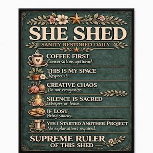May include: A framed sign with the words "SHE SHED" at the top, followed by phrases like "Coffee First" and "Creative Chaos." The sign has a dark green background with floral and star accents, creating a vintage aesthetic.
