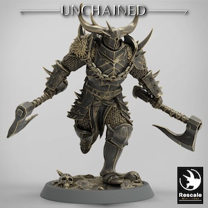 May include: A detailed figurine of a warrior in dark armour, wielding two axes. The figure has a horned helmet and chainmail accents. The base features skulls and the text "UNCHAINED". The Rescale Miniatures logo is in the lower right corner.