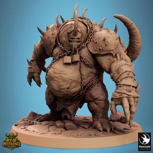 May include: A brown monster figurine with horns, spikes, and chains. The creature has a large belly and clawed hands. The base of the figurine has the text "PIT OF PESTILENCE VOLUME II".
