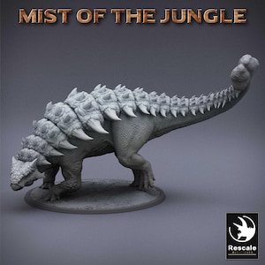 May include: A gray dinosaur figurine with the text "MIST OF THE JUNGLE" at the top. The dinosaur has a spiked back and tail, and is standing on a circular base. The Rescale Miniatures logo is in the bottom right corner.