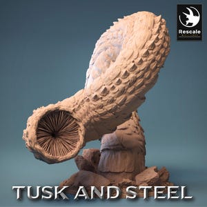 May include: A beige, textured sculpture of a fantastical creature with the text "Tusk and Steel" at the bottom. The sculpture has a large, open mouth and a scaled body. The Rescale Miniatures logo is in the upper right corner.