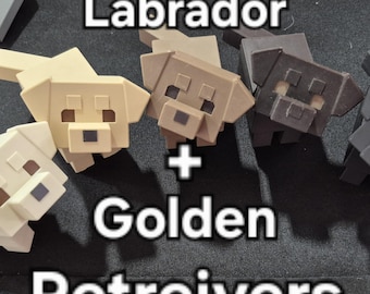 May include: A collection of blocky, pixelated dog figurines in cream, tan, and dark brown colours. The text "Labrador + Golden Retreivers" is overlaid on the image. Each figurine features a square head, simple facial features, and a tail.