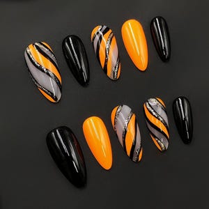 Halloween Hand Painted Press On Nails – Orange & Black Swirl Design, Glossy Almond Nails with Glitter Accents, Spooky Season Fake Nail Set