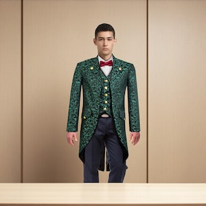 May include: A green tailcoat with a floral pattern, gold buttons, and a matching vest. The outfit includes a white shirt, a red bow tie, and dark blue trousers. The ensemble is formal and elegant.