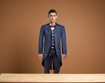 May include: A formal navy blue suit with a floral pattern, featuring a long tailcoat, vest, and trousers. The suit has gold buttons and is paired with a white shirt and a red bow tie. The background is a solid brown.
