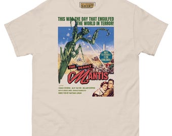 May include: A beige t-shirt with a vintage movie poster print of a giant praying mantis attacking a city. The poster reads "The Deadly Mantis" and includes the tagline "This was the day that engulfed the world in terror!"