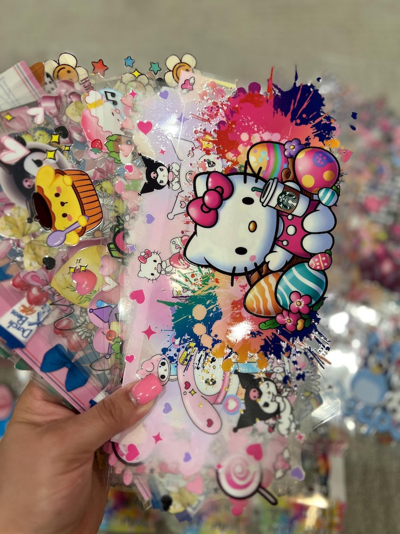 May include: A set of colorful, transparent stickers featuring Hello Kitty and other cartoon characters. The stickers are decorated with hearts, stars, and other cute designs. The stickers are perfect for adding a touch of whimsy to your planner, journal, or laptop.