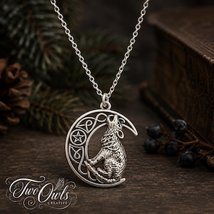 May include: A silver-toned pendant necklace featuring a crescent moon shape with a howling wolf silhouette. The design includes intricate Celtic knotwork and a small five-pointed star symbol within the moon. The pendant hangs from a silver chain.