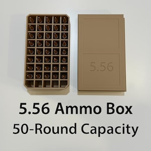 May include: Tan 5.56 ammo box with 50-round capacity. The open box displays rows of bullets. The lid is next to the box and has the number 5.56 printed on it. The text "5.56 Ammo Box 50-Round Capacity" is below the box.