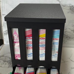 May include: A rustic wooden sign with the text "Welcome to our home" in white lettering. The sign features a distressed finish and a simple, inviting design, perfect for entryway decor.