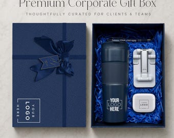 May include: A navy blue gift box with a matching ribbon and tag, containing a dark blue tumbler, a white phone stand, a white earbud case, and a pen. Each item features a placeholder for a logo. The box lid displays the text Premium Corporate Gift Box.