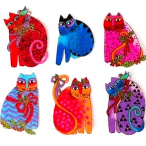 May include: Six colorful, hand-painted cat ornaments with festive bows and details. Each ornament features a unique design and color scheme, including red, blue, pink, purple, orange, and green.