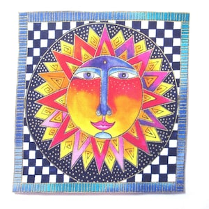 May include: A colorful sun with a face, surrounded by a black and white checkered pattern and a blue and gold border.