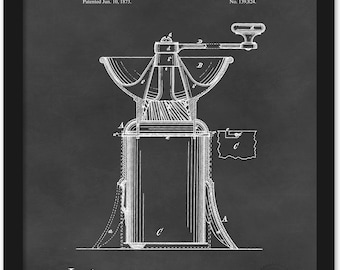 Puede incluir: Ilustración de patente enmarcada de un molinillo de café, con el texto "UNITED STATES PATENT OFFICE" en la parte superior. El diagrama es en blanco sobre un fondo oscuro, mostrando el funcionamiento interno del molinillo. La patente fue concedida el 10 de junio de 1873.