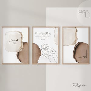 May include: Three minimalist Islamic art prints with Arabic calligraphy and abstract shapes in brown and white. The prints feature the words "Sabr" and "And your Lord says, 'Call upon Me, I will respond to you.'"