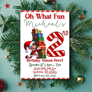 May include: A festive invitation with the text "Oh What Fun Micheal's 2nd Birthday Almost Here!" features a cartoon elf carrying gifts. The invitation is decorated with red and white stripes and Christmas greenery.