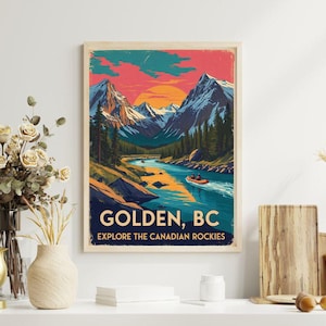 Puede incluir: Un cuadro enmarcado con un paisaje de Golden, BC, con un río y montañas bajo un atardecer. La impresión incluye el texto "GOLDEN, BC" y "EXPLORE THE CANADIAN ROCKIES".