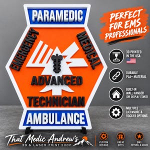 May include: A hexagonal orange, white, and blue sign featuring the text PARAMEDIC, EMERGENCY MEDICAL, ADVANCED TECHNICIAN, and AMBULANCE in raised black and blue lettering. A black Star of Life symbol is centered on a white triangular shape.