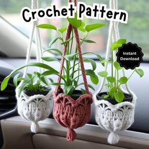 May include: Three crocheted plant hangers with tassels hanging from the rearview mirror of a car. The hangers are white, pink, and white. The text "crochet pattern" is at the top of the image. The text "Instant Download" is in a circle at the top right of the image.