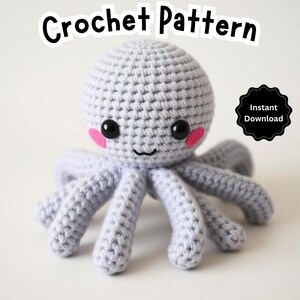 May include: A crocheted gray octopus with pink cheeks and black eyes. The octopus is smiling. The image includes the text "Crochet Pattern" and "Instant Download".