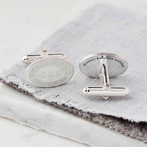 May include: Silver oval cufflinks with engraved initials "C&S" and a date. The other cufflink has the text "Yours forever xxxx" engraved on it.