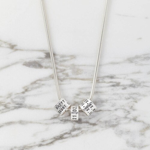 Personalised Sterling Silver Storyteller Necklace - a necklace with shops sterling silver charms stamped with your words telling your story