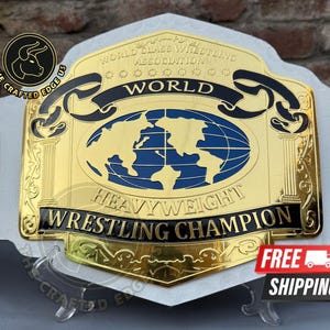 May include: A gold and blue heavyweight wrestling championship belt with the words "World Heavyweight Wrestling Champion" and a world map design. The belt has a white strap and gold side plates.