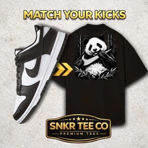 May include: Black and white Nike Dunk Low sneakers next to a black t-shirt featuring a panda bear graphic. The panda holds a Nike swoosh. Text on the shirt reads "SNKR TEE CO - PREMIUM TEES". The image also includes the text "MATCH YOUR KICKS".