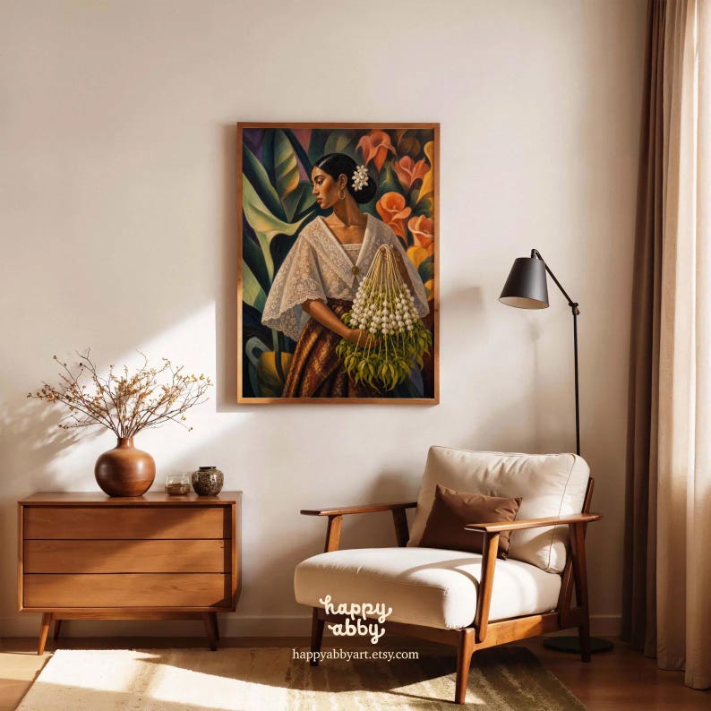 May include: A framed wall art print featuring a painting of a person wearing a white lace-trimmed blouse and a patterned skirt, holding a large bouquet of white flowers against a backdrop of green leaves and orange blossoms, with the text happy abby.