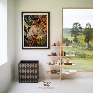 May include: A framed painting of a person in a white lace top holding a bundle of white flowers, a dark wooden box with a diamond pattern, and a light wood tiered shelving unit holding small vases, books, and boxes, with the text happy abby.