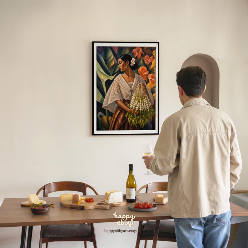 May include: A framed wall art print depicting a person wearing a white lace blouse and a brown skirt, holding a large bundle of white flowers. The artwork features a vibrant background of orange flowers and green leaves, displayed in a black frame.