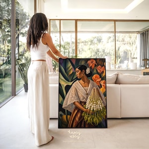 May include: A framed rectangular painting depicting a person with dark hair in a bun, wearing a white lace-trimmed blouse and a brown patterned skirt, holding a large bouquet of white flowers against a background of orange lilies and green leaves.