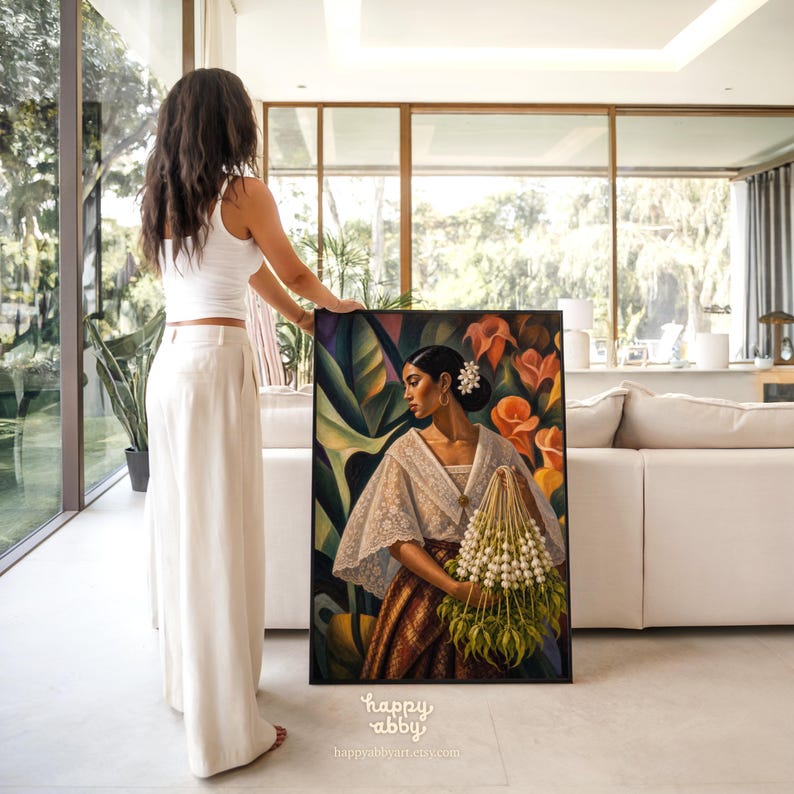 May include: A framed rectangular painting depicting a person with dark hair in a bun, wearing a white lace-trimmed blouse and a brown patterned skirt, holding a large bouquet of white flowers against a background of orange lilies and green leaves.
