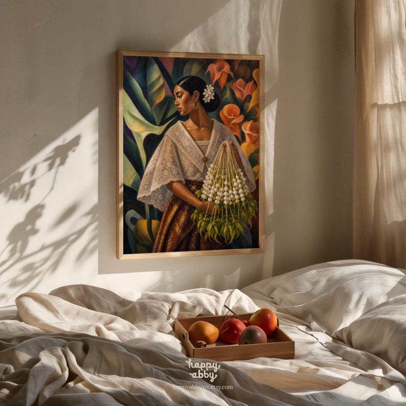 May include: A framed wall art print depicting a person wearing a white lace blouse and a brown patterned skirt, holding a large bouquet of white flowers. The background features large green leaves and orange flowers in a vibrant, painterly style.