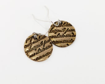 Golden Bronze Disc Earrings With Engraved Writing.